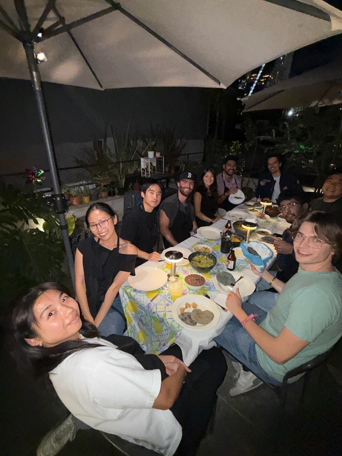 The Replo team around a rooftop dinner table in Mexico City