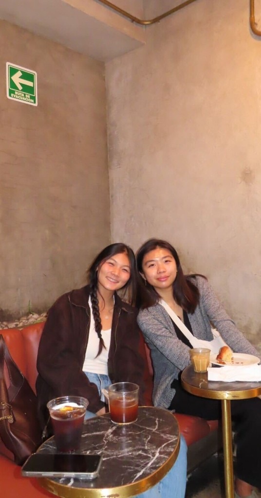 Two Replo teammates having iced coffee in Mexico City