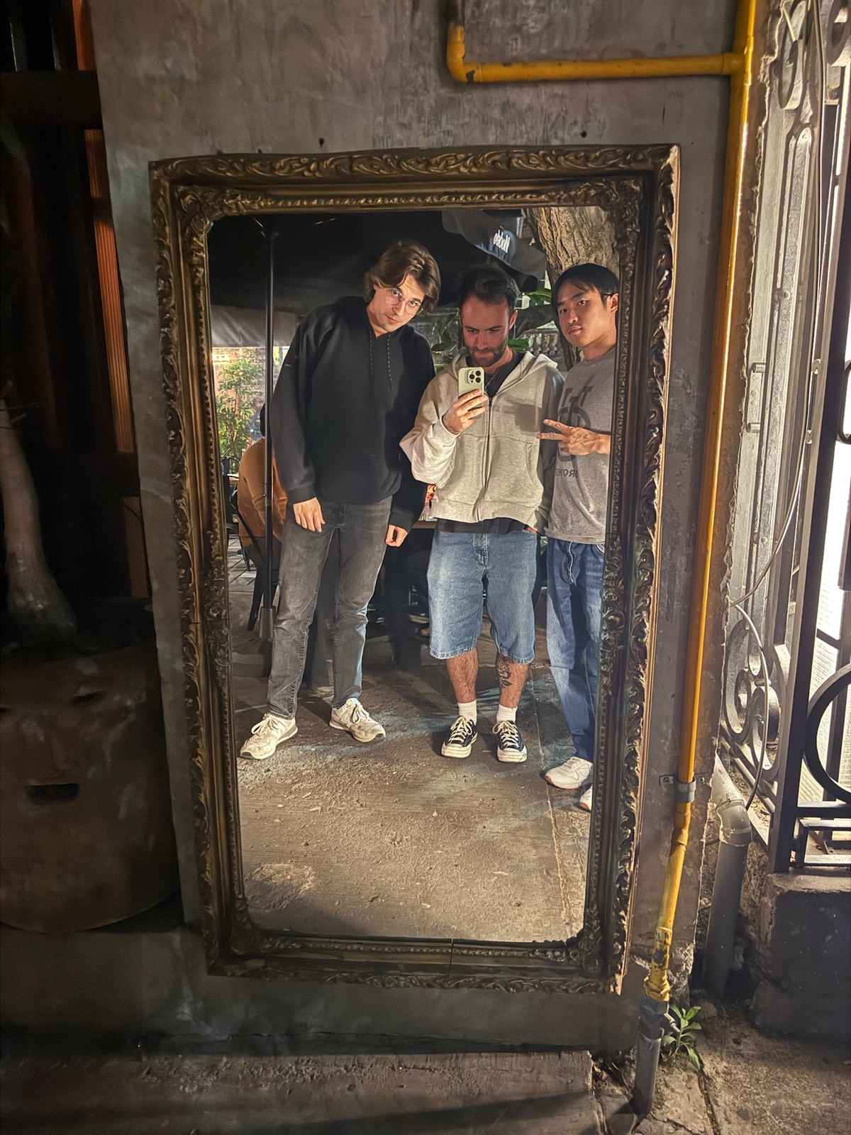 Three Replo teammates taking a mirror selfie in Mexico City